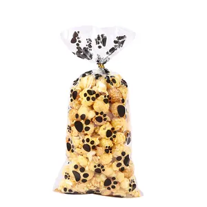 Bolsa transparente de OPP para comida con huellas de perro negras y lazos dorados