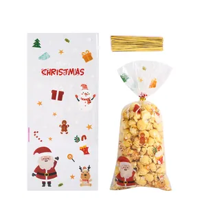 Transparente Weihnachts-Süßigkeitentüten mit Weihnachtsmann-Motiv und goldenen Bindern