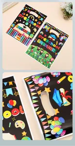 Detail of preschool graduation gift bag with colorful cartoon patterns and balloons