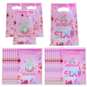 Pink donut themed 6th birthday party gift bags made of pearl film for candy packaging.