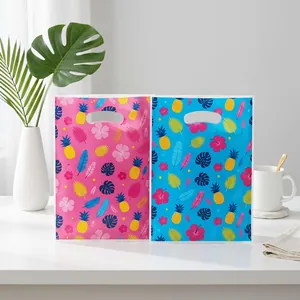 Tropical Hawaiian gift bags with hibiscus flowers and pineapple prints in pink and blue