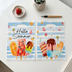 Summer popsicle gift bags with blue white stripes and flamingo prints for pool parties.