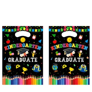 Kindergarten graduation party gift bags with colorful school patterns and handle cutout