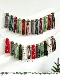 Close-up of handmade Bohemian Christmas tassel banner with wooden beads