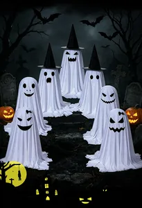 Standing Halloween ghosts with witch hats and spooky faces in a graveyard setting