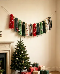 Bohemian Christmas tassel garland with wooden beads hanging over a festive fireplace scene