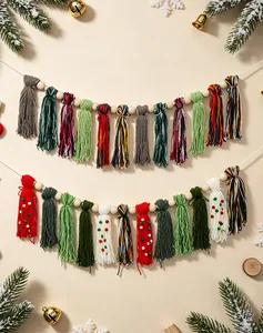 Detailed view of handmade Christmas tassel garland with wooden beads and festive colors.