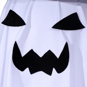 Close-up view of a scary black ghost face printed on white fabric for Halloween party decor.