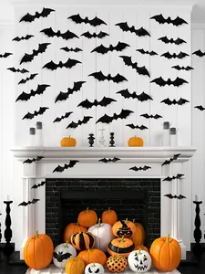 3D Halloween vleermuis muurstickers op een witte open haard met pompoenen.