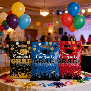 Set of 3 colorful graduation party gift bags with 'Congrats GRAD' print and die-cut handles