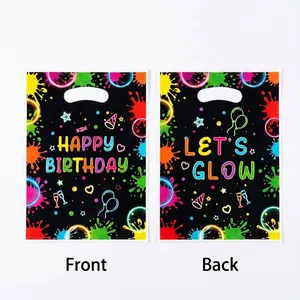 Neon glow-in-the-dark birthday gift bags with black splatter design and handles