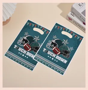 Two American football themed party favor bags featuring helmets and touchdown graphics