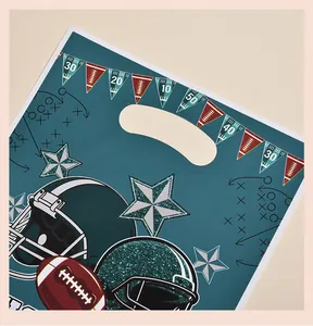 Close-up of sports-themed party gift bag featuring football helmets and star patterns.