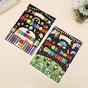 Preschool graduation party gift bags with colorful cartoon patterns and die-cut handles
