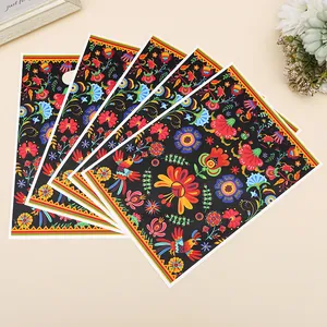 Vibrant ethnic floral pattern shopping gift bags arranged on a warm minimalist background
