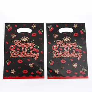 Two black Happy Birthday gift bags featuring cherry and leopard print design elements