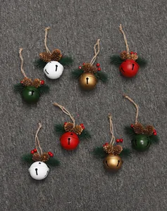 Overhead view of colorful Christmas bell ornaments decorated with pine cones and berries.
