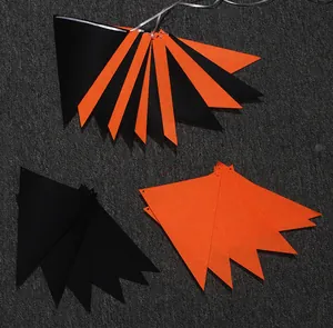 Detail view of orange and black felt triangular bunting flags for Halloween