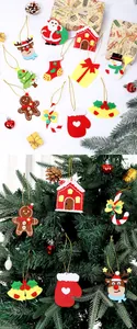 Assorted felt Christmas ornaments hanging on a tree and laid out with gift boxes.