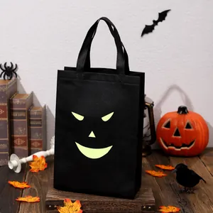 Bolsa de caramelos fantasma de Halloween luminosa para niños, bolsa de regalo negra