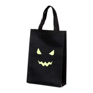 Bolsa de caramelos de Halloween negra con cara de fantasma luminosa para regalo niños