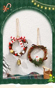 Detail view of two decorative Christmas vine wreaths with festive ornaments and ribbons.