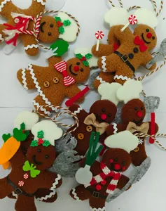 Close-up of plush chef gingerbread man Christmas tree ornaments with cute kitchen accessories