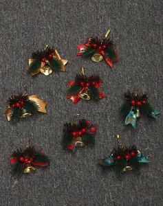 Detailed view of varied Christmas bell ornaments with festive bows and pine needles