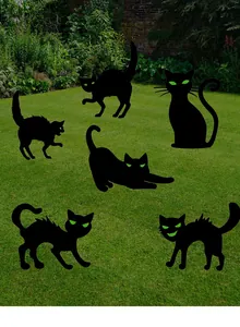 Set of six glowing green-eyed black cat silhouettes for Halloween lawn and garden decoration