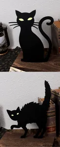 Close-up of Halloween luminous black cat yard stakes with mysterious glowing eyes