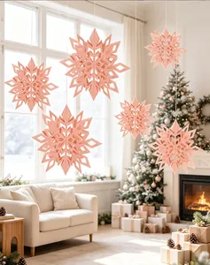 Beautiful 3D peach paper snowflake ornaments hanging in a cozy Christmas living room