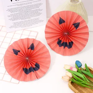 Halloween orange paper fans with black jack-o'-lantern faces for party decoration