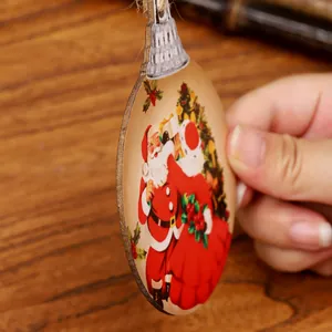 Vintage wooden Santa Claus Christmas tree ornament decoration with rustic hanging twine.