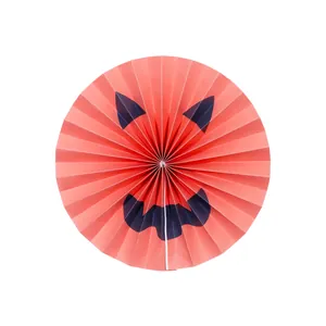 Halloween orange pleated paper fan with spooky demon face for festive party decoration