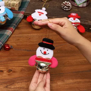 Festive Christmas snowman bell ornament with plush hat and ribbon, perfect tree pendant.