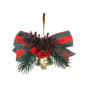 Decorative festive Christmas tree ornament with a golden bell, striped bow and pinecones.