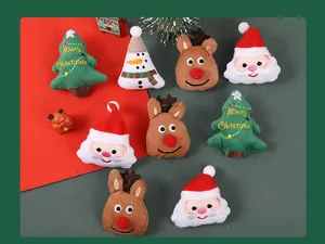 Selection of plush Christmas brooches featuring Santa, reindeer, and tree designs.