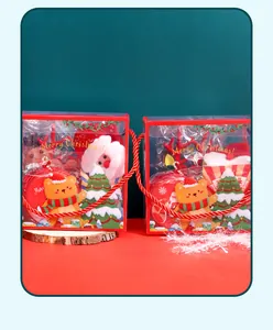 Detail view of festive Christmas toy gift boxes with clear windows and red rope handles