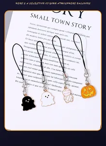 Close-up of Halloween cartoon alloy charms featuring ghost, pumpkin, and mummy shapes.
