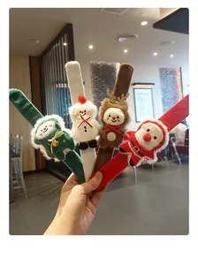 Hand-held plush Christmas slap bracelets featuring cute Santa Claus and reindeer icons