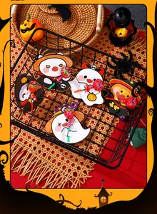 Halloween lollipop decorative cards with cute ghost and pumpkin designs in a wire basket