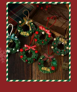 High-quality detail view of mini Christmas wreaths with bells and colorful decorative ribbons