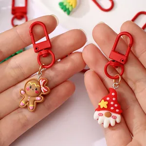 Cute Christmas resin keychains featuring gingerbread man and gnome charms as gifts