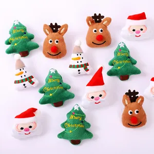 Assorted Christmas plush brooches featuring Santa, reindeer, and trees for DIY holiday gifts