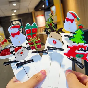 Assorted festive Christmas hair clips featuring Santa, reindeer, and snowman icons