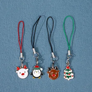 Juego de cuatro bonitos colgantes navideños de aleación con diseños de reno pingüino y árbol