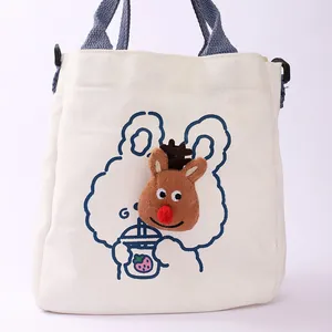 Adorable white canvas tote bag featuring a 3D Christmas reindeer plush brooch accessory