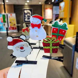 Festive Christmas hair clips set with Santa Claus, Snowman and gift box motifs for kids
