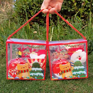 Festive Christmas toy gift set in clear PVC tote bag with red handles and Santa