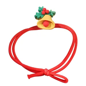 Cute Christmas elastic hair tie with yellow bell and holly leaves on white background
